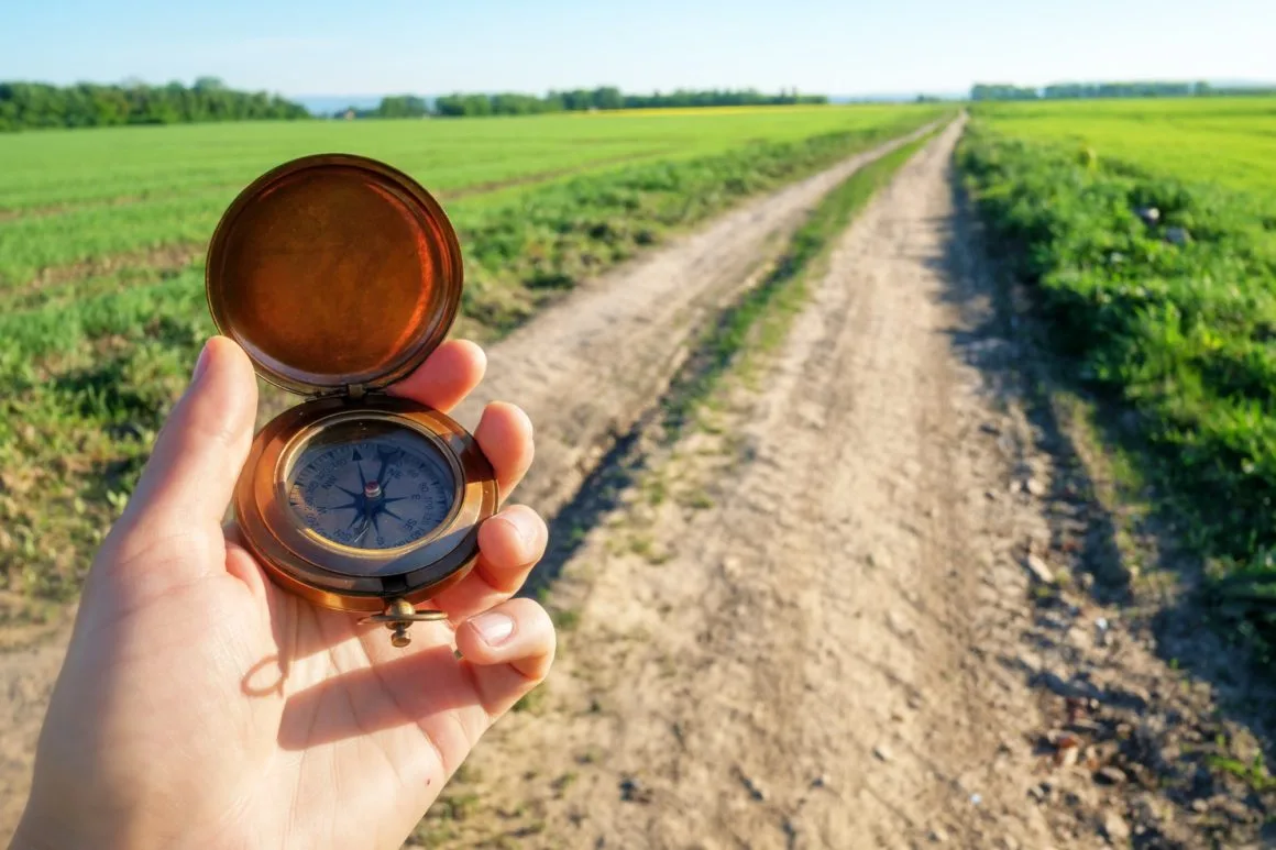 Man with compass in hand