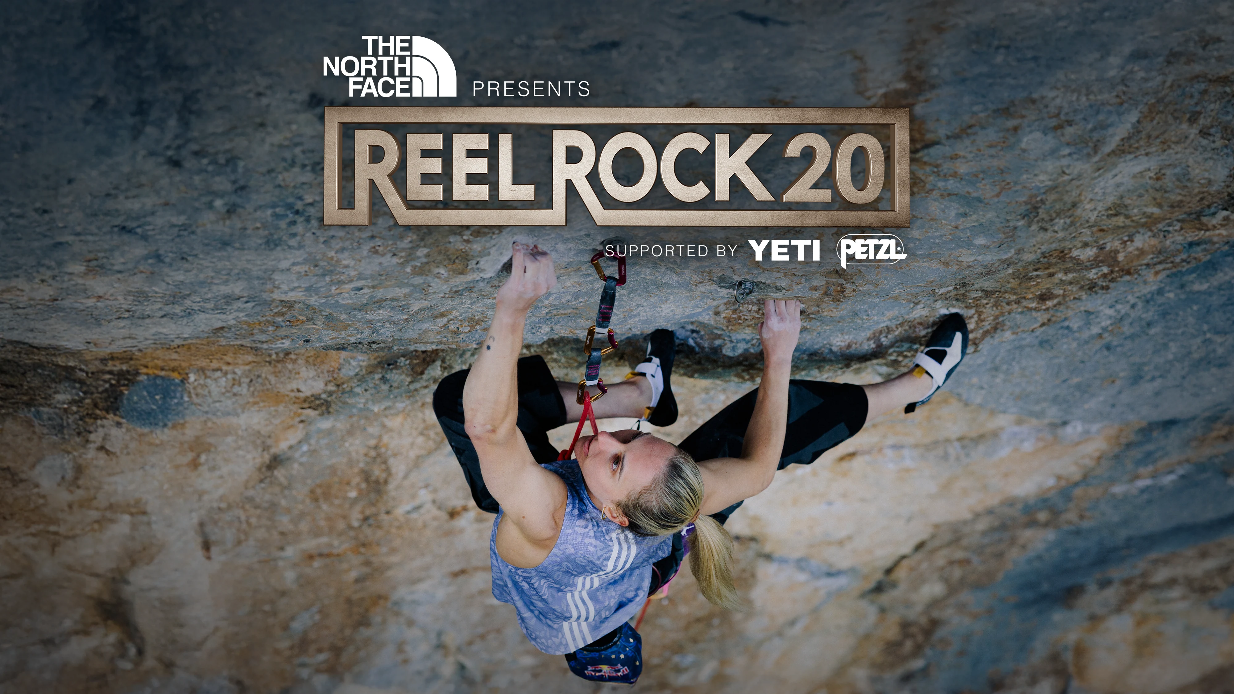 Gráfico promocional oficial de Reel Rock 20 con el logotipo dorado sobre una escaladora en una pared desplomada.